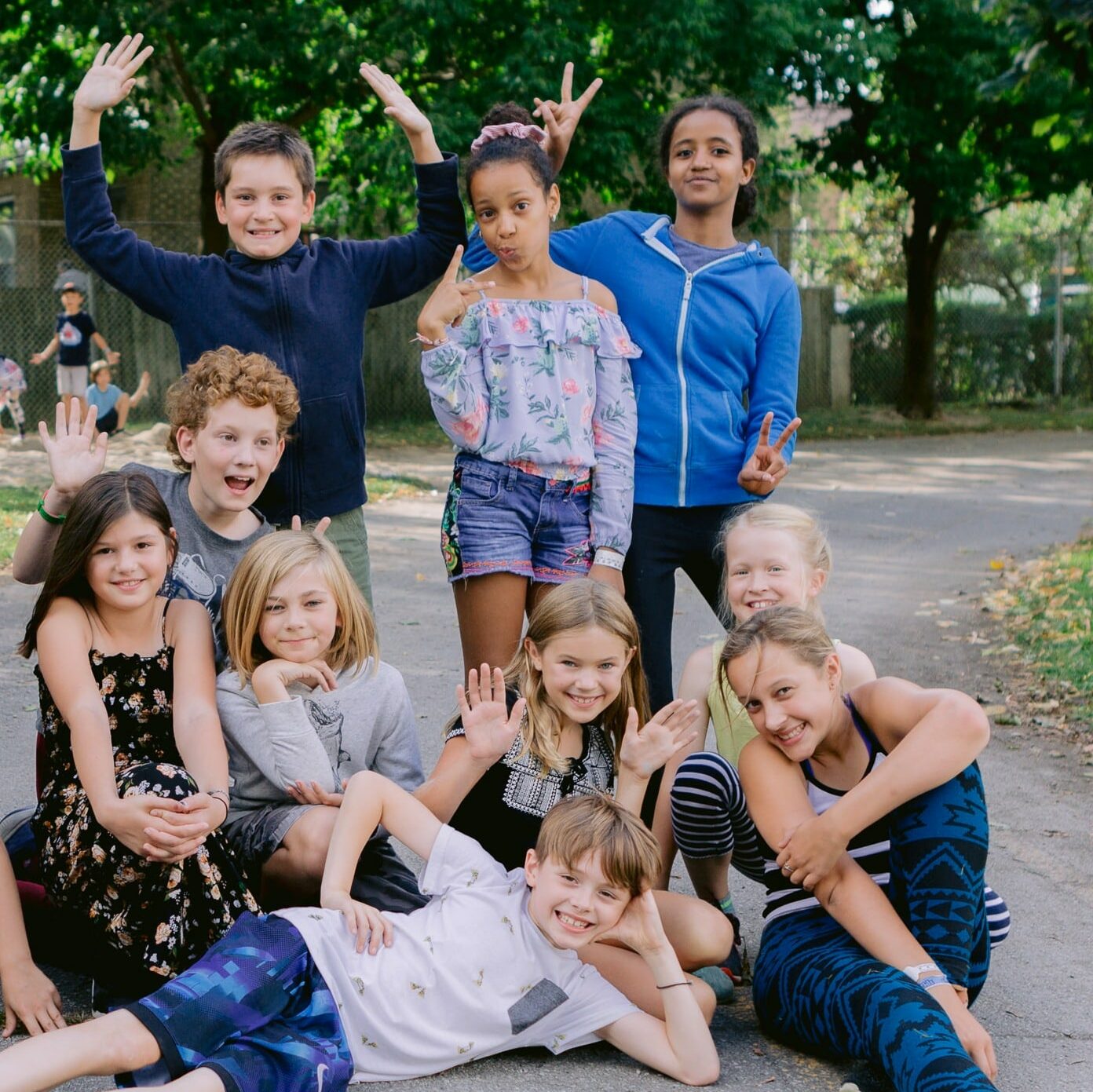 Applegrove Kids in the school yard smiling and making silly faces for the camera